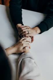 Hands intertwined representing support